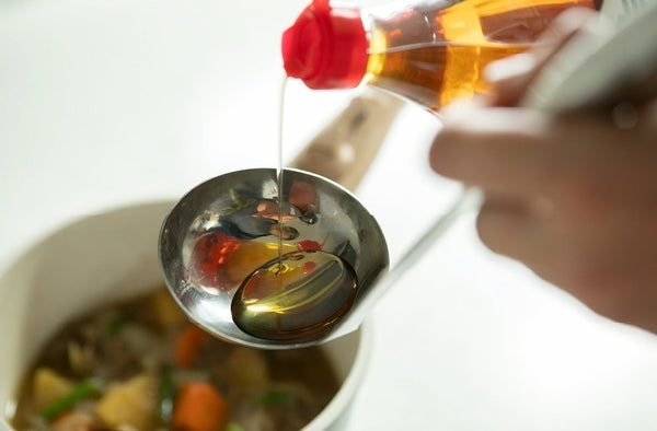 hon mirin rice wine sauce pouring onto a ladle